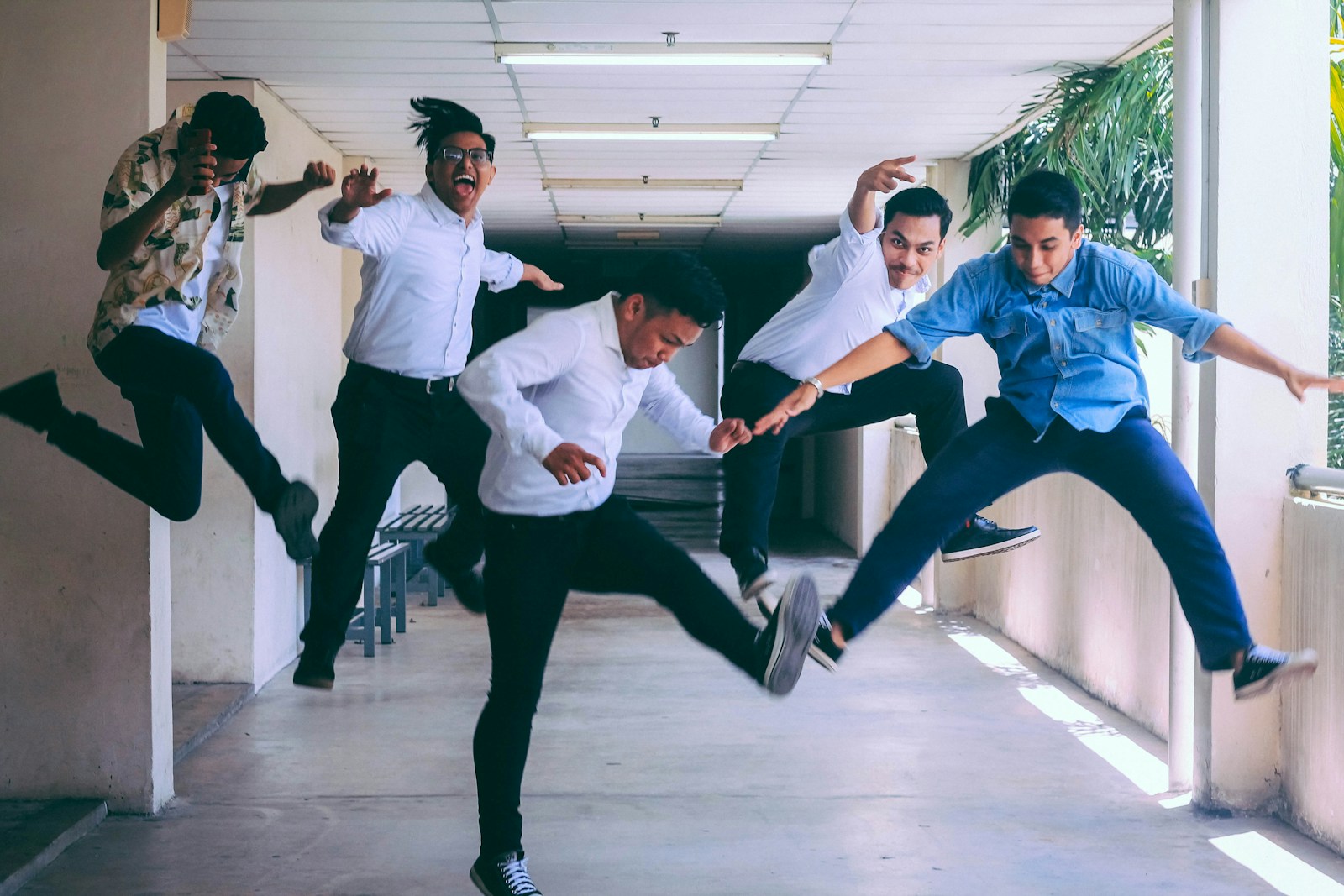 Photo by Husna Miskandar group of people doing jump shot photography