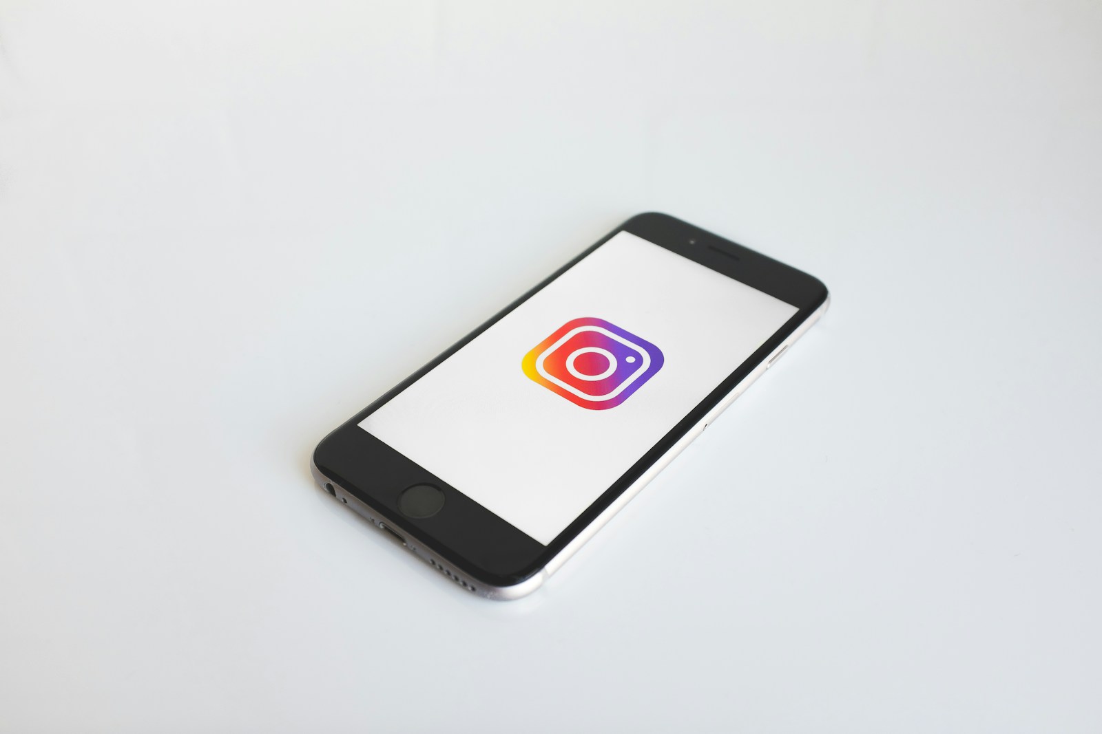 Photo by Kenny Eliason Instagram logo in space gray iPhone 6